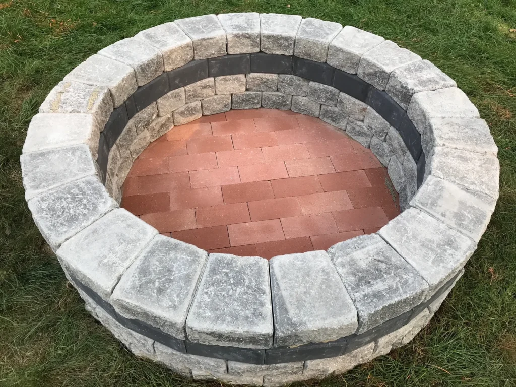 outdoor-firepits-services-fairfield-county - Creative Minds Landscaping LLC - Creative Minds Landscaping LLC Custom Outdoor Firepits Services in Fairfield County creating cozy backyard gathering spaces, with patio construction and seating wall design.